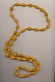 Hand knotted necklace made of amber color Bakelite beads, 1930's, length 42'' 107cm.